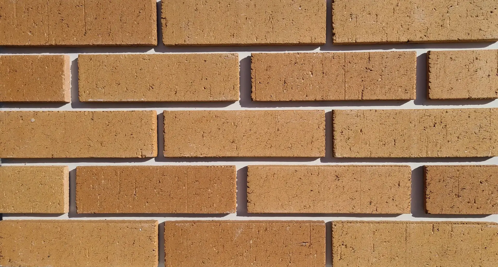The close up of reddish yellow brick wall