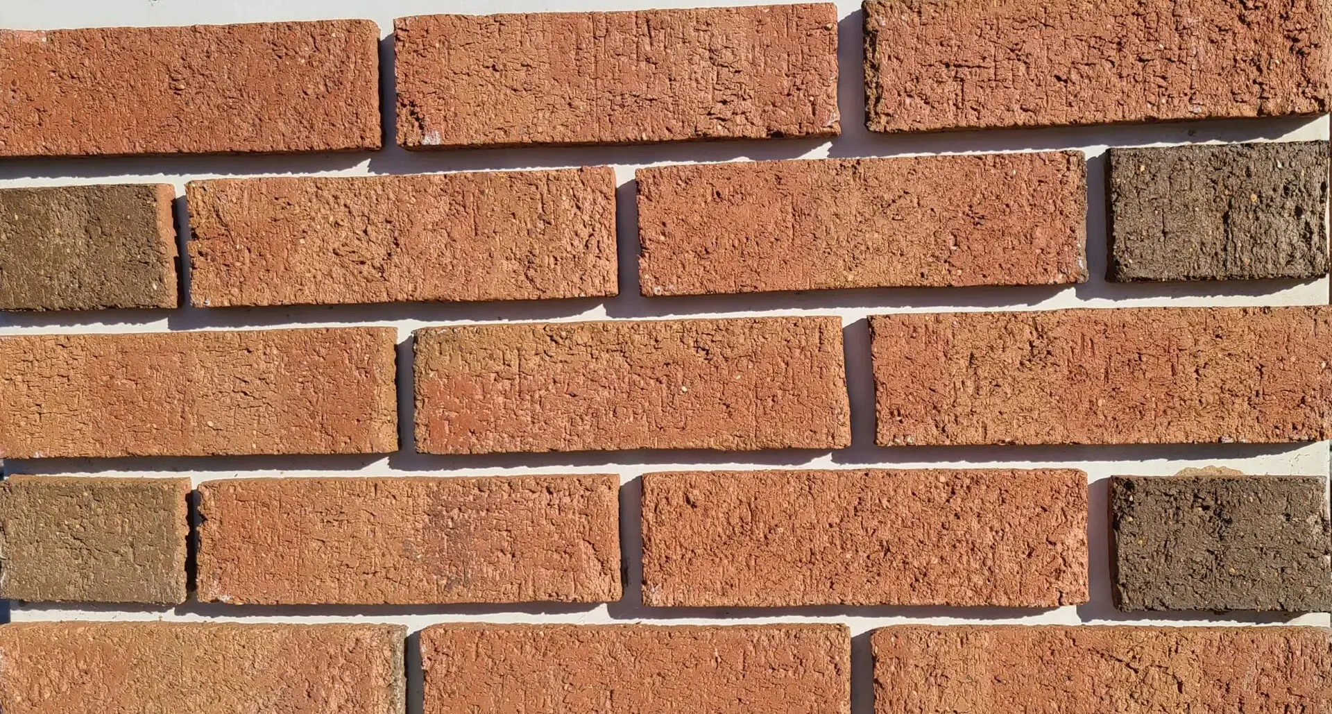 The close up of red rough brick walls